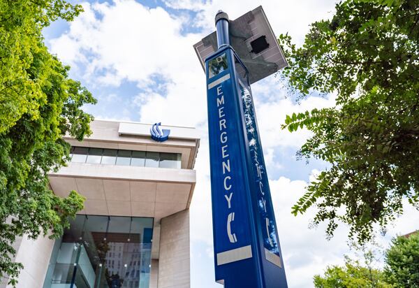 An emergency call box on Georgia State University's campus is one several dozen emergency call boxes and hundreds of new security cameras and exterior lights added to the campus. (Seeger Gray / AJC)