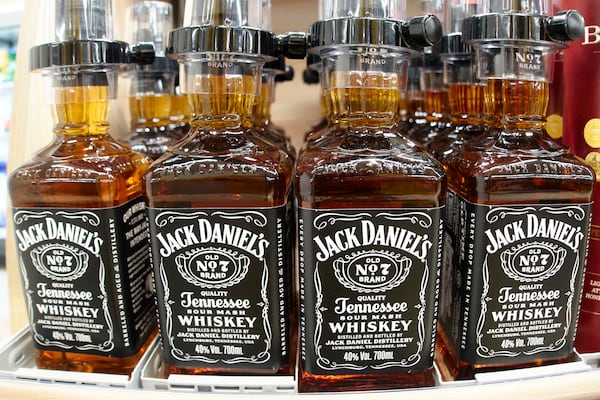 Whiskey stands in a board in a discount store in Frankfurt, Germany, Wednesday, March 12, 2025. (AP Photo/Michael Probst)