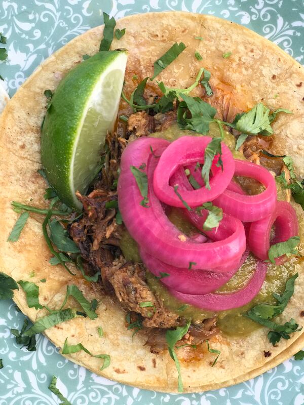 Botica's pork pibil taco comes with pickled onions. Courtesy of Botica