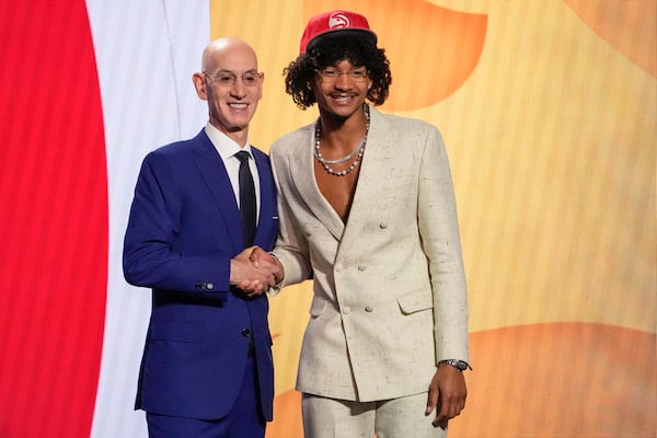 Kobe Bufkin poses for a photo with NBA Commissioner Adam Silver after being selected 15th overall by the Atlanta Hawks during the NBA basketball draft, Thursday, June 22, 2023, in New York. (AP Photo/John Minchillo)