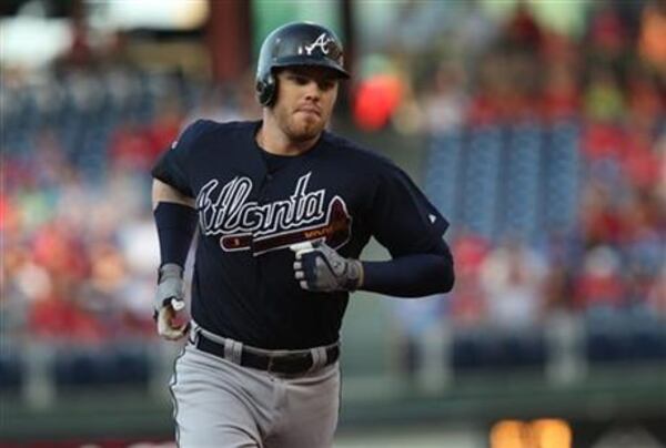 Freeman hit this three-run homer at Philadelphia over the weekend and now faces a Mets team he's hit well against throughout his career. (AP photo)