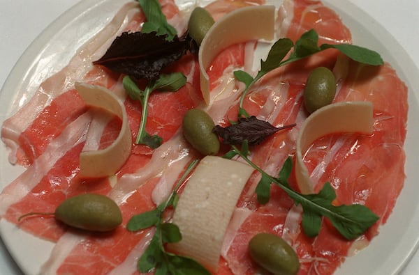 Prosciutto di San Daniele with Cerignola Olives at Mumbo Jumbo. / AJC file photo