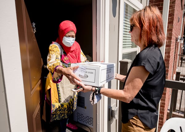 Volunteers with Open Hand Atlanta deliver food.