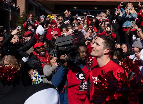 230114-Athens-UGA quarterback Stetson Bennett pauses to soak in the crowd during the Dawg Walk before the UGA football celebration Saturday, Jan. 14, 2023 in Athens. Ben Gray for the Atlanta Journal-Constitution