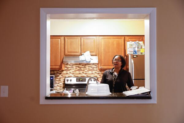 Rosalyn Martin stands in the kitchen that she shares with a roommate at Mary Hall Freedom Village on Thursday, March 13, 2025. (Natrice Miller/AJC)