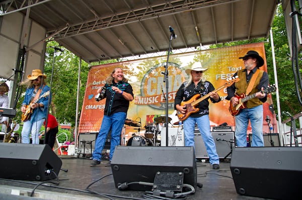 Stuart Swanlund, Doug Gray, Pat Elwood, and Rick Willis of The Marshall Tucker Band perform during day 1 of the 2013 CMA Music Festival on June 6, 2013, in Nashville, Tenn. (Photo by Amy Harris/Invision/AP)