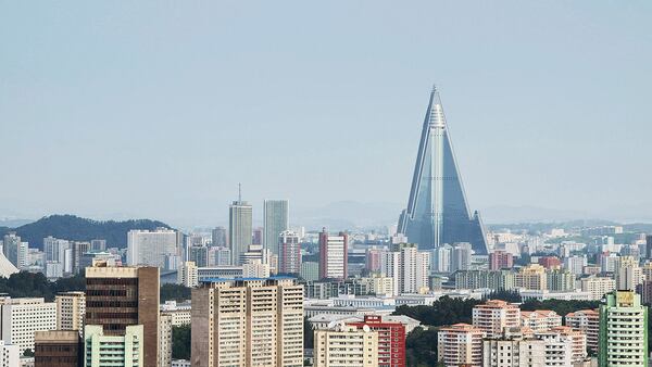 PYONGYANG, NORTH KOREA - AUGUST 24:  A view of the Pyongyang cityscape, looking towards the Ryugyong Hotel Tower from Yanggakdo Hotel on August 24, 2015 in Pyongyang, North Korea. North and South Korea today came to an agreement to ease tensions following an exchange of artillery fire at the demilitarized border last week.  (Photo by Xiaolu Chu/Getty Images)