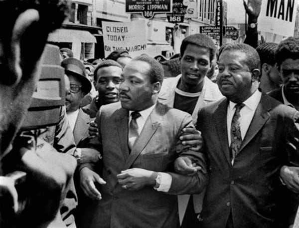 FILE -In this March 28, 1968 file photo, Dr. Martin Luther King Jr. and Rev. Ralph Abernathy, right, lead a march on behalf of striking Memphis, Tenn., sanitation workers. Forty-five years after Martin Luther King Jr. was killed supporting a historic sanitation workers strike in Memphis, the city�s garbage and trash collectors are fighting to hold on to jobs that some city leaders want to hand over to a private company. (AP Photo/The Commercial Appeal, Sam Melhorn, File)