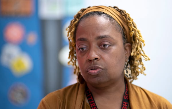 Carmena Woods, school administrative assistant, takes part with students in a restorative circle,  where students are prompted to talk about conflict issues going on in their lives and where conflict resolution skills are discussed, at Tri-Cities High School in East Point on Tuesday, March 29, 2022.   (Bob Andres / robert.andres@ajc.com)