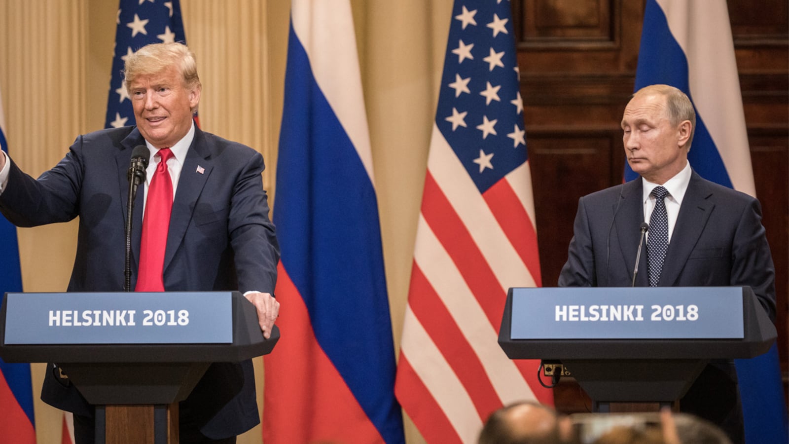 U.S. President Donald Trump (L) and Russian President Vladimir Putin speak to the media during a joint press conference after their summit on July 16, 2018 in Helsinki, Finland. The White House has invited Putin to Washington.