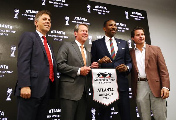 Dietmar Exler, Chief Operating Officer Mercedes-Benz Stadium (from left), Governor Brian Kemp, Mayor Andre Dickens, and Dan Corso, Atlanta Sports Council, take the stage during the Host City announcement press conference for the 2026 World Cup at Mercedes-Benz Stadium on Thursday, June 16, 2022, in Atlanta. Atlanta wants to get its short-term rental regulations in proper order ahead of this event and many others.  “Curtis Compton / Curtis.Compton@ajc.com”