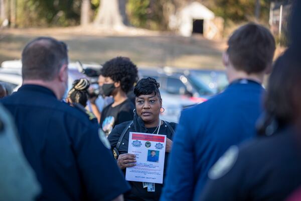 Atlanta police Maj. D’Andrea Price gives instructions to officers as they start to canvass Atlanta’s Westview community Thursday.