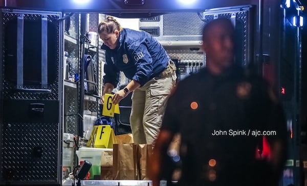 Riverdale police and GBI investigators were on the scene of a deadly shooting at a townhome complex off Roy Huie Road in Riverdale.  JOHN SPINK / JSPINK@AJC.COM