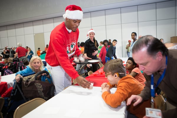 Cam serves a cup of cheer to a special new friend! All photos: Cam Newton Foundation/Andreas Seibold.