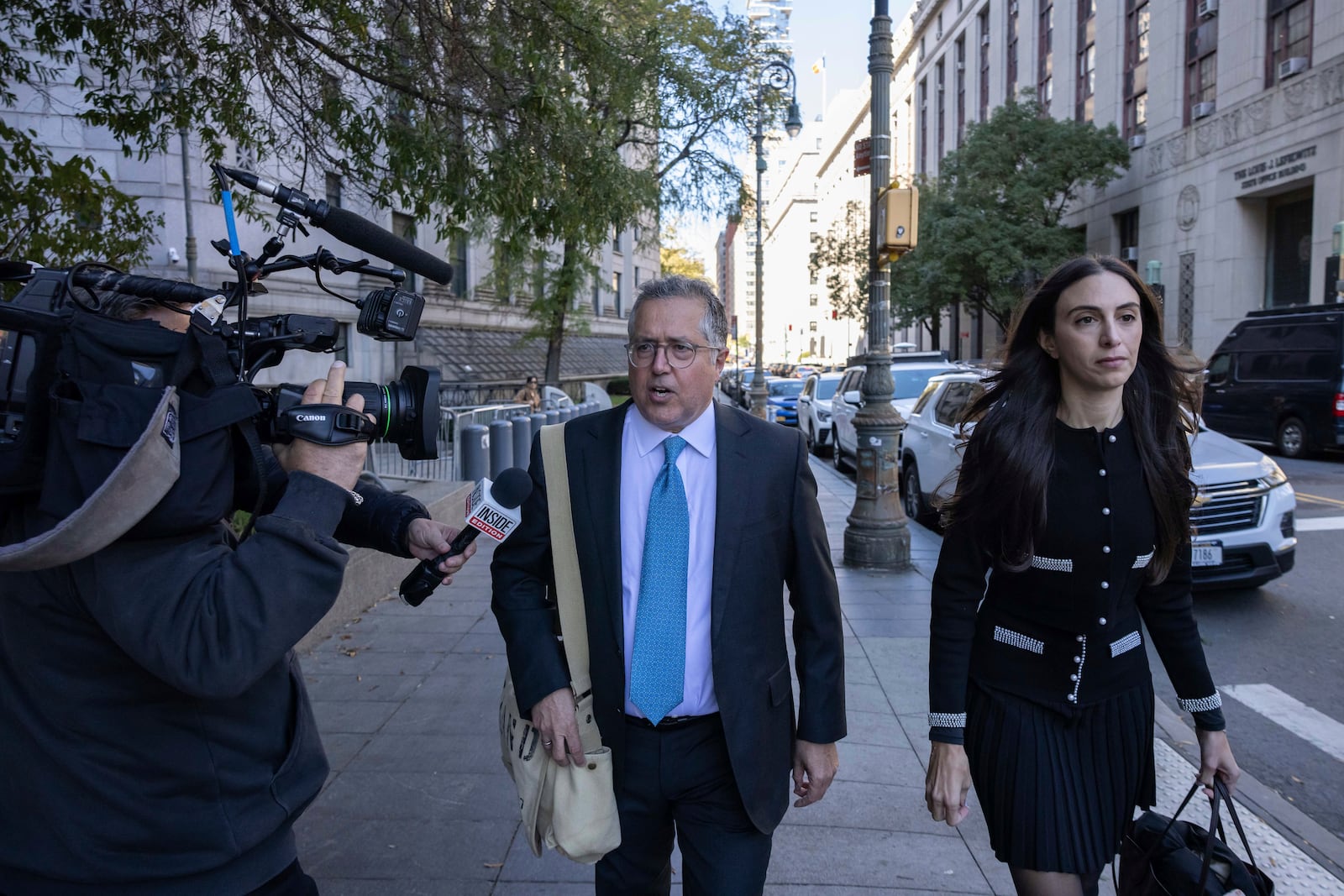 Attorney Marc Agnifilo, center, and Teny Geragos, right, for Sean "Diddy Combs, arrive at Manhattan federal court, Thursday, Oct. 10 2024, in New York. (AP Photo/Yuki Iwamura)