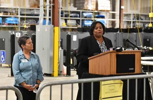 Nadine Williams, interim elections chief, speaks to members of the press as Cathy Woolard (left), chairwoman, looks on at Fulton County Election Preparation Center on Tuesday, May 24, 2022. (Hyosub Shin / Hyosub.Shin@ajc.com)