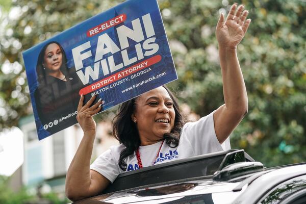 Fulton County District Attorney Fani Willis rides in a car while participating in the Inman Park Parade on Saturday, April 27, 2024, in Atlanta. (Elijah Nouvelage for The Atlanta Journal-Constitution)