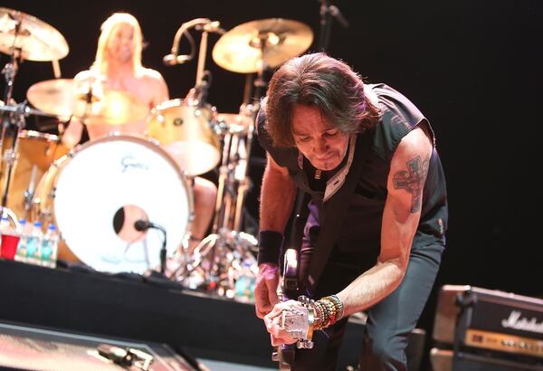 NEW YORK, NY - FEBRUARY 13: Musician Rick Springfield of the Sound City Players performs at Hammerstein Ballroom on February 13, 2013 in New York City. (Photo by Mike Lawrie/Getty Images) Careful how ya bend there, buddy. Photo: Getty Images.