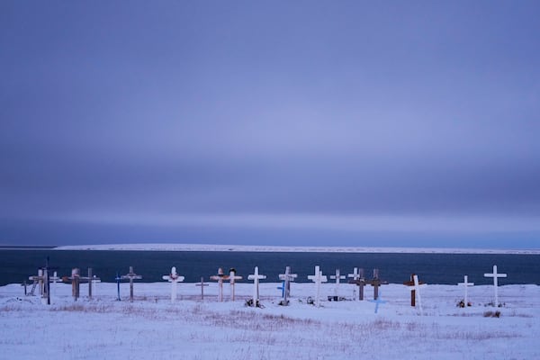 Grave markers are seen at the village's cemetery facing the Kaktovik Lagoon and the coastal plain of the Arctic National Wildlife Refuge Monday, Oct. 14, 2024, in Kaktovik, Alaska. (AP Photo/Lindsey Wasson)