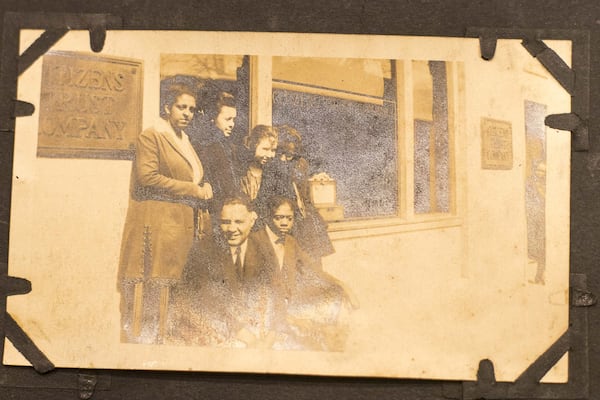 A vintage photograph of people gathered outside of Citizens Trust Bank is archived at the bank in downtown Atlanta. The photos were given to the bank by a member. ALYSSA POINTER / ALYSSA.POINTER@AJC.COM