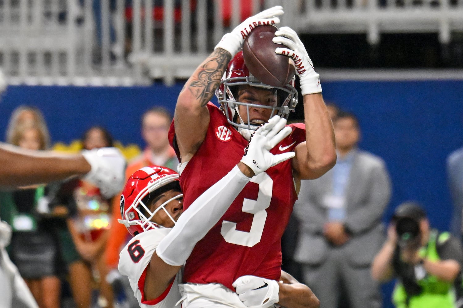 Alabama Crimson Tide wide receiver Jermaine Burton (3) brings down a 15 yard touchdown pass in front of Georgia Bulldogs defensive back Daylen Everette (6) during the first half of the SEC Championship football game at the Mercedes-Benz Stadium in Atlanta, on Saturday, December 2, 2023. (Hyosub Shin / Hyosub.Shin@ajc.com)