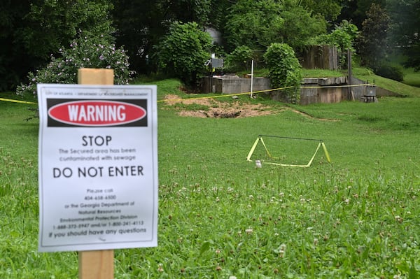 An area between Atlanta Avenue and Ormond Street near Greenfield Street is secured due to sewage contamination in Peoplestown on Tuesday, July 7, 2020, after recent flooding. HYOSUB SHIN / HYOSUB.SHIN@AJC.COM