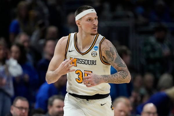 Missouri guard Jacob Crews (35) celebrates after making a basket during the first half of the first round against Drake of the NCAA college basketball tournament, Thursday, March 20, 2025, in Wichita, Kan. (AP Photo/Charlie Riedel)