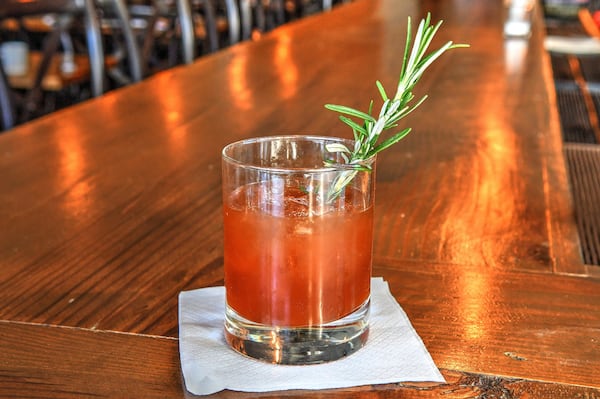 A Rosemary’s Baby, prepared by Kasey Emmett, who heads the bar program at the Pinewood in Decatur, includes pomegranate molasses. STYLING BY KASEY EMMETT / CONTRIBUTED BY CHRIS HUNT PHOTOGRAPHY