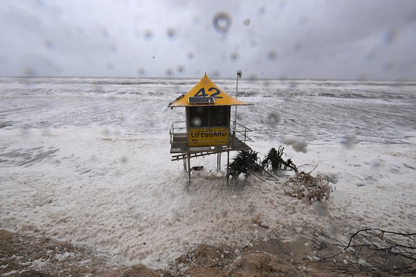 A lifeguard tower is surrounded by heavy seas following Cyclone Alfred on the Gold Coast, Australia, Saturday, March 8, 2025. (Dave Hunt/AAP Image via AP)