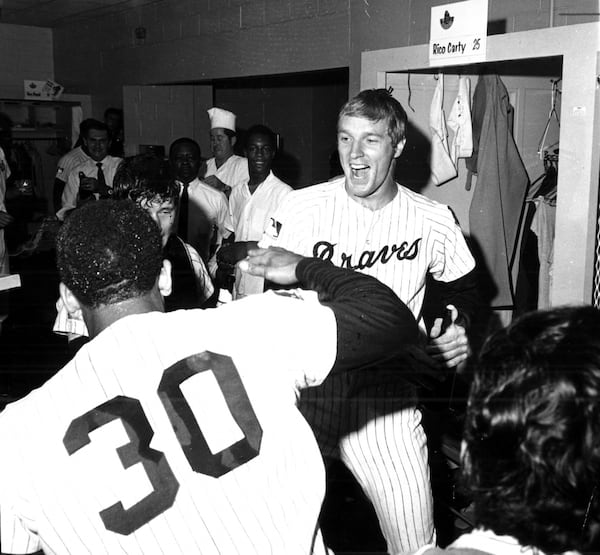 After the Braves won the NL Western Division on Sept. 30, 1969, Ron Reed (right) and Orlando Cepeda expressed their joy in the clubhouse. (AJC file photo)