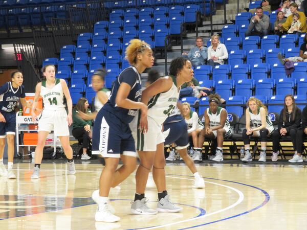 Avyonce Carter of the Wesleyan Lady Wolves posts up Jordan Isaacs of the St. Francis Lady Knights during their game at UNG's Convocation Center in Dahlonega on Saturday, March 2, 2019. (Adam Krohn/special)