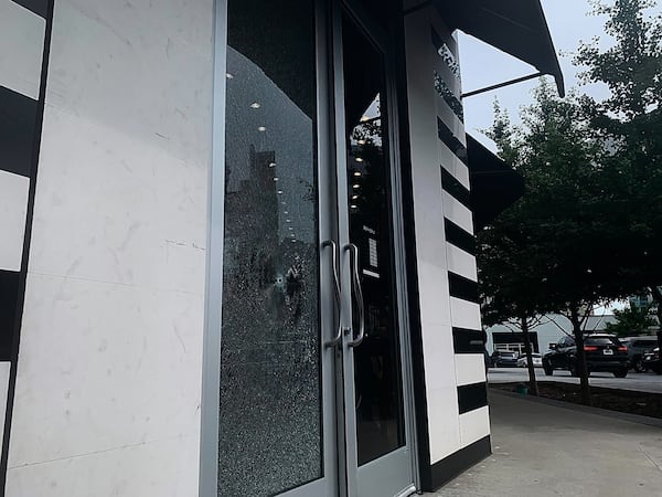 A bullet shattered the front door of a Buckhead storefront Tuesday afternoon.