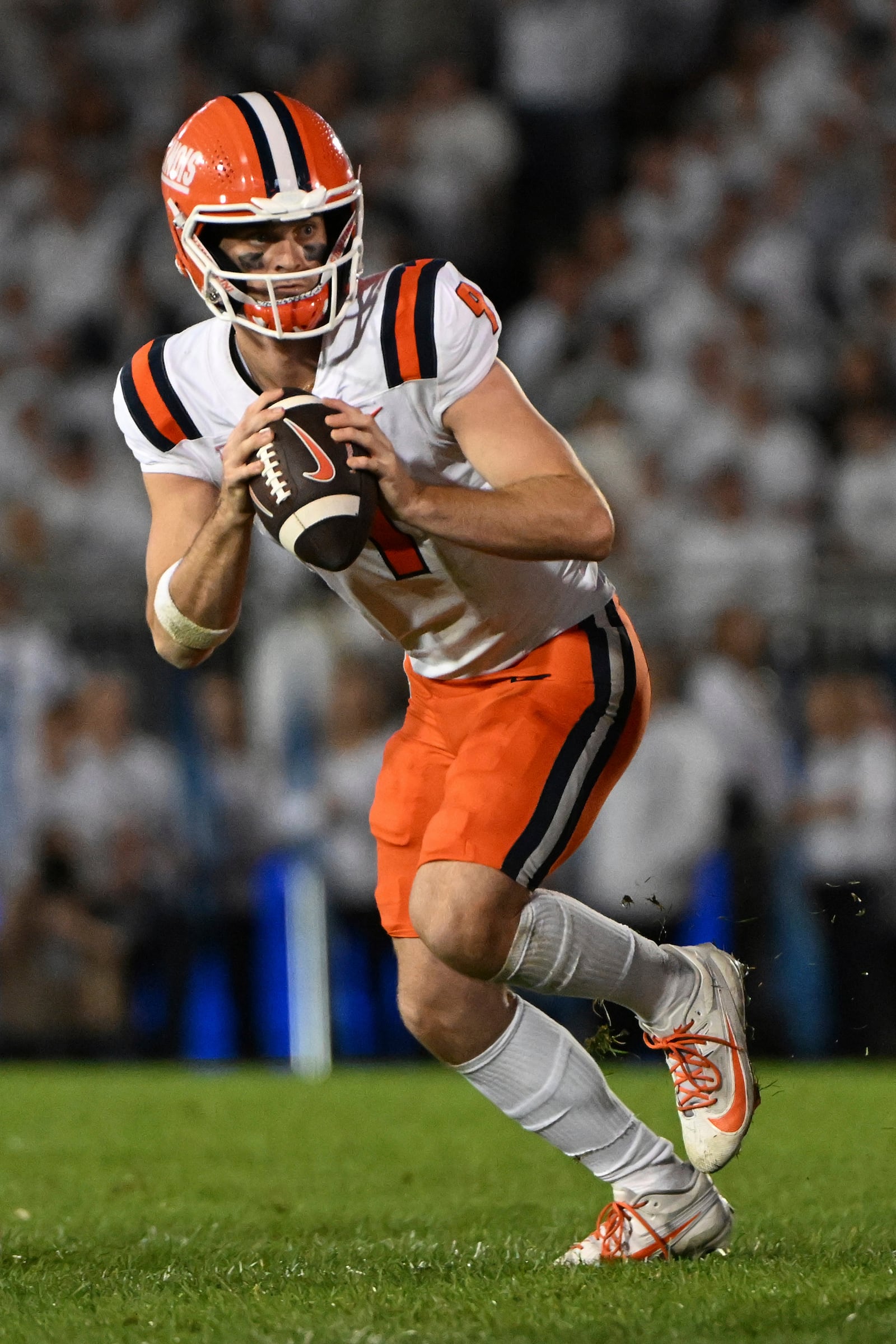 Illinois quarterback Luke Altmyer (9) runs against Penn State during the second quarter of an NCAA college football game, Saturday, Sept. 28, 2024, in State College, Pa. (AP Photo/Barry Reeger)