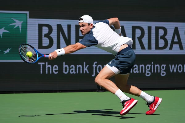 Jack Draper, of Great Britain, returns to Holger Rune, of Denmark, during the final match at the BNP Paribas Open tennis tournament Sunday, March 16, 2025, in Indian Wells, Calif. (AP Photo/Mark J. Terrill)