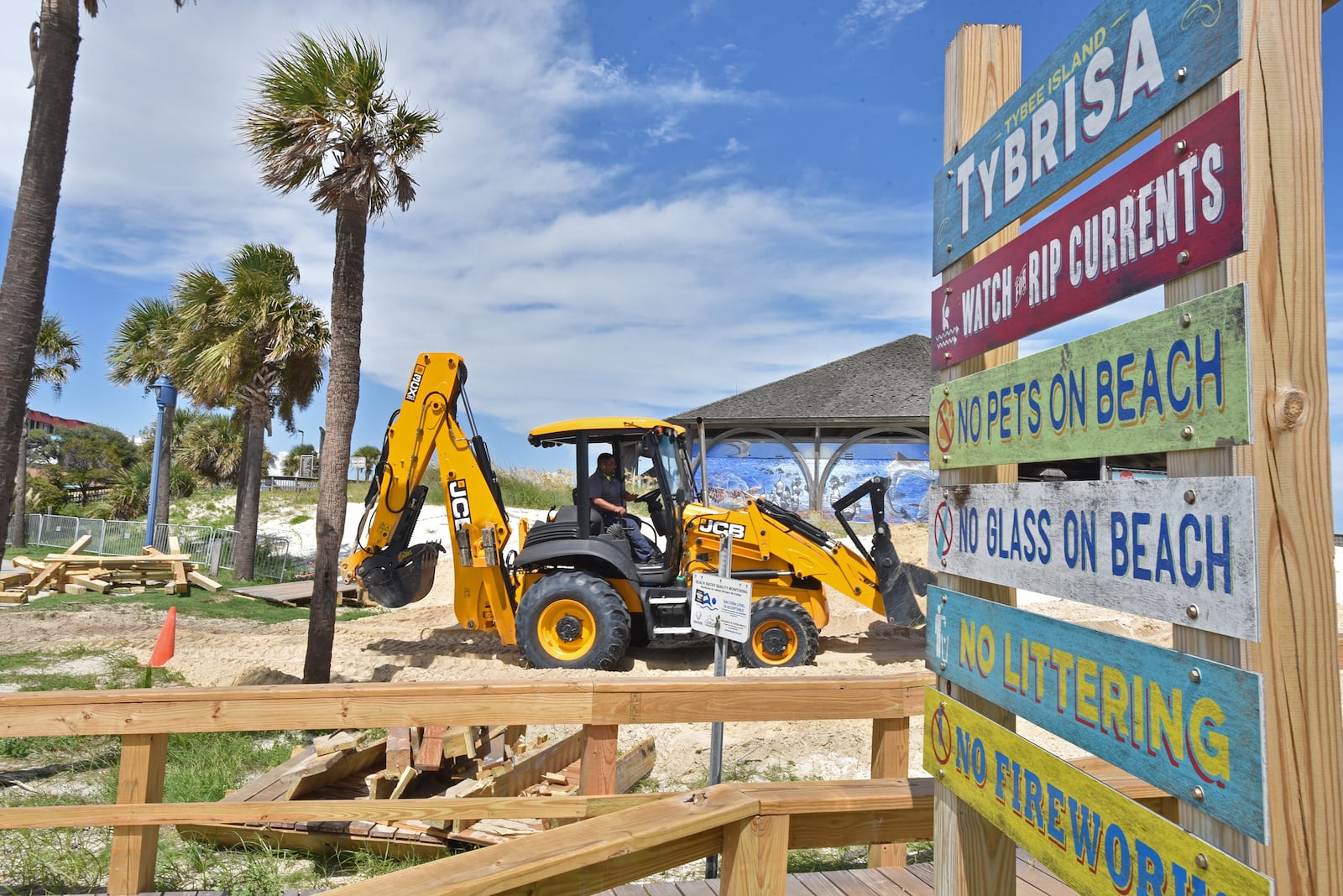 A worker builds a dune on Tybee Island ahead of Hurricane Dorian Tuesday. 