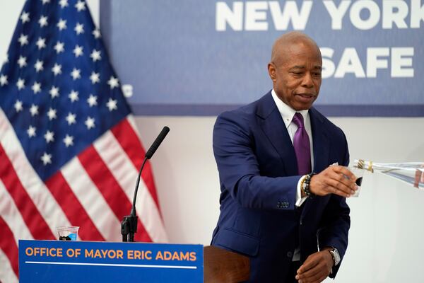 FILE — New York Mayor Eric Adams gets a refill of NYC tap water while speaking to reporters at a news conference about repairs to the water supply infrastructure in New York, Sept. 30, 2024. (AP Photo/Seth Wenig, File)