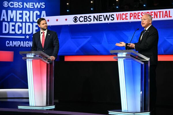 U.S. Sen. JD Vance of Ohio (left) and Minnesota Gov. Tim Walz participate in a vice presidential debate on Tuesday in New York.