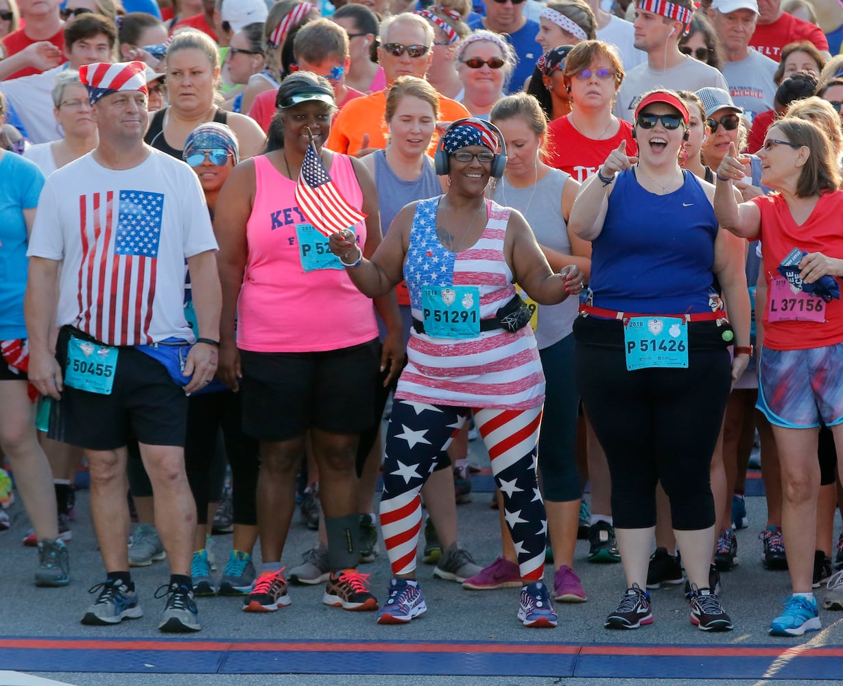 Runners show fashion flair during AJC Peachtree Road Race