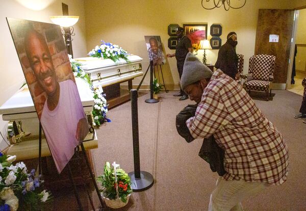 Large photographs of the DeKalb fire victims were set up during the visitation Wednesday at the Gregory B. Levett & Sons Funeral Home in Decatur. (STEVE SCHAEFER FOR THE ATLANTA JOURNAL-CONSTITUTION)