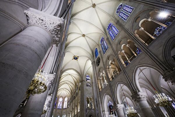 The nave of Notre-Dame de Paris cathedral is seen while French President Emmanuel Macron visits the restored interiors of the cathedral, Friday Nov. 29, 2024, in Paris. (Stephane de Sakutin, Pool via AP)