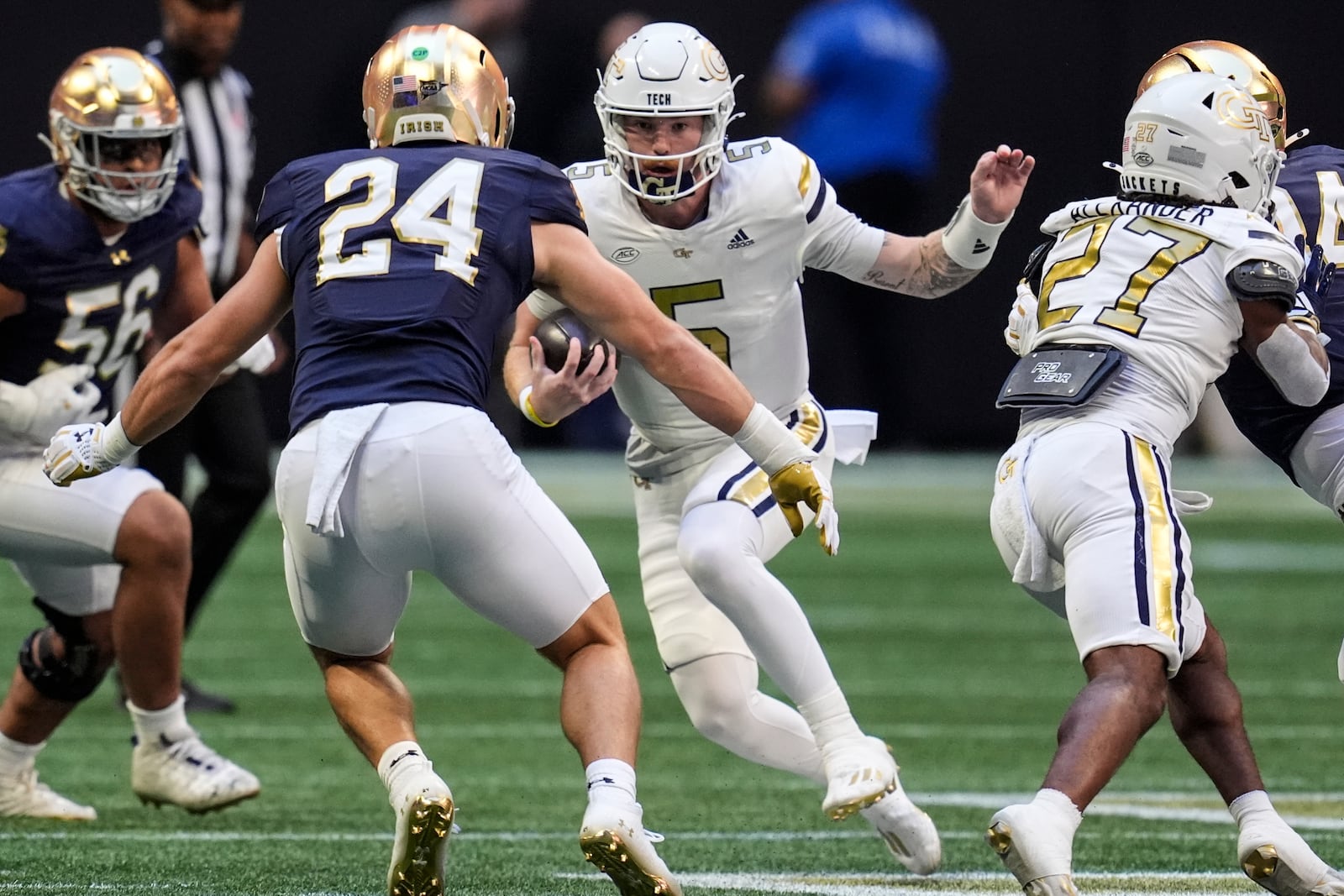 Georgia Tech quarterback Zach Pyron (5) runs against Notre Dame linebacker Jack Kiser (24) during the first half of an NCAA college football game, Saturday, Oct. 19, 2024, in Atlanta. (AP Photo/Mike Stewart)