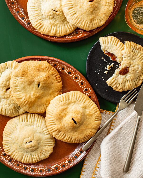 Coyotas are round Mexican pastries with a sweet filling traditionally made with grated piloncillo, although dark brown sugar can be used as a substitute. Recipe from "Treasures of the Mexican Table" by Pati Jinich. (Courtesy of Angie Mosier)