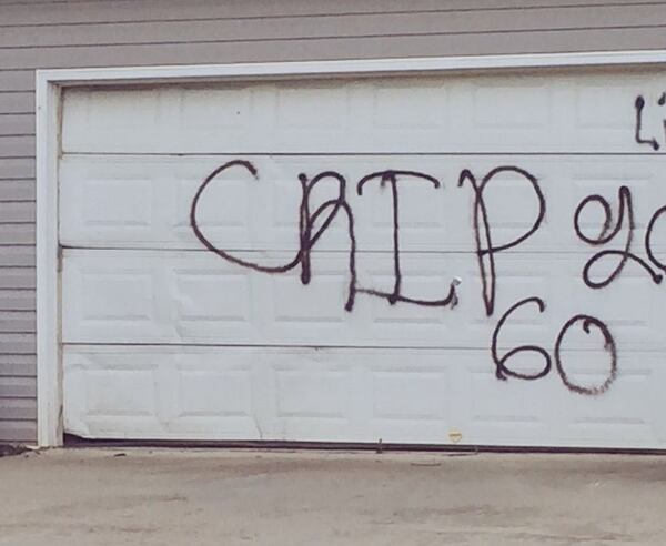 This was spray-painted on one garage door in the neighborhood. (Credit: Channel 2 Action News)