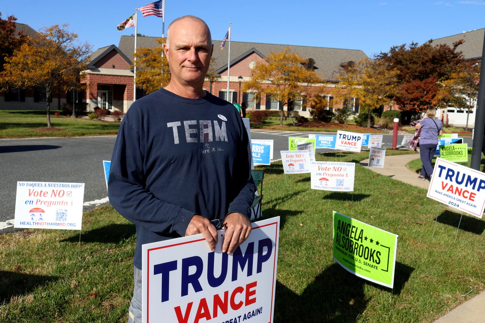 Jon Michael, a Republican who voted early for Republican former Gov. Larry Hogan for U.S. Senate in Maryland, as well as for former President Donald Trump, stands outside an early voting center on Kent Island in Chester, Md., Thursday, Oct. 24, 2024. (AP Photo/Brian Witte)