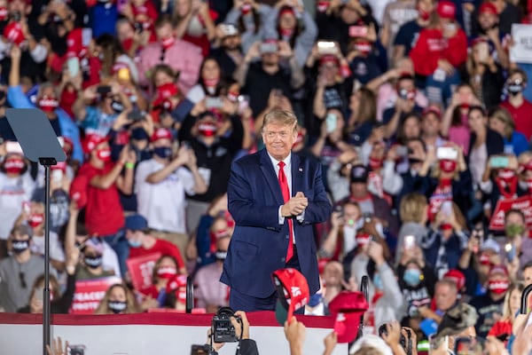 President Donald Trump speaks at a rally earlier this month at Middle Georgia Regional Airport in Macon. It was his third visit in recent months to Georgia, which has become a battleground state in the race for the White House.  (Alyssa Pointer / Alyssa.Pointer@ajc.com)