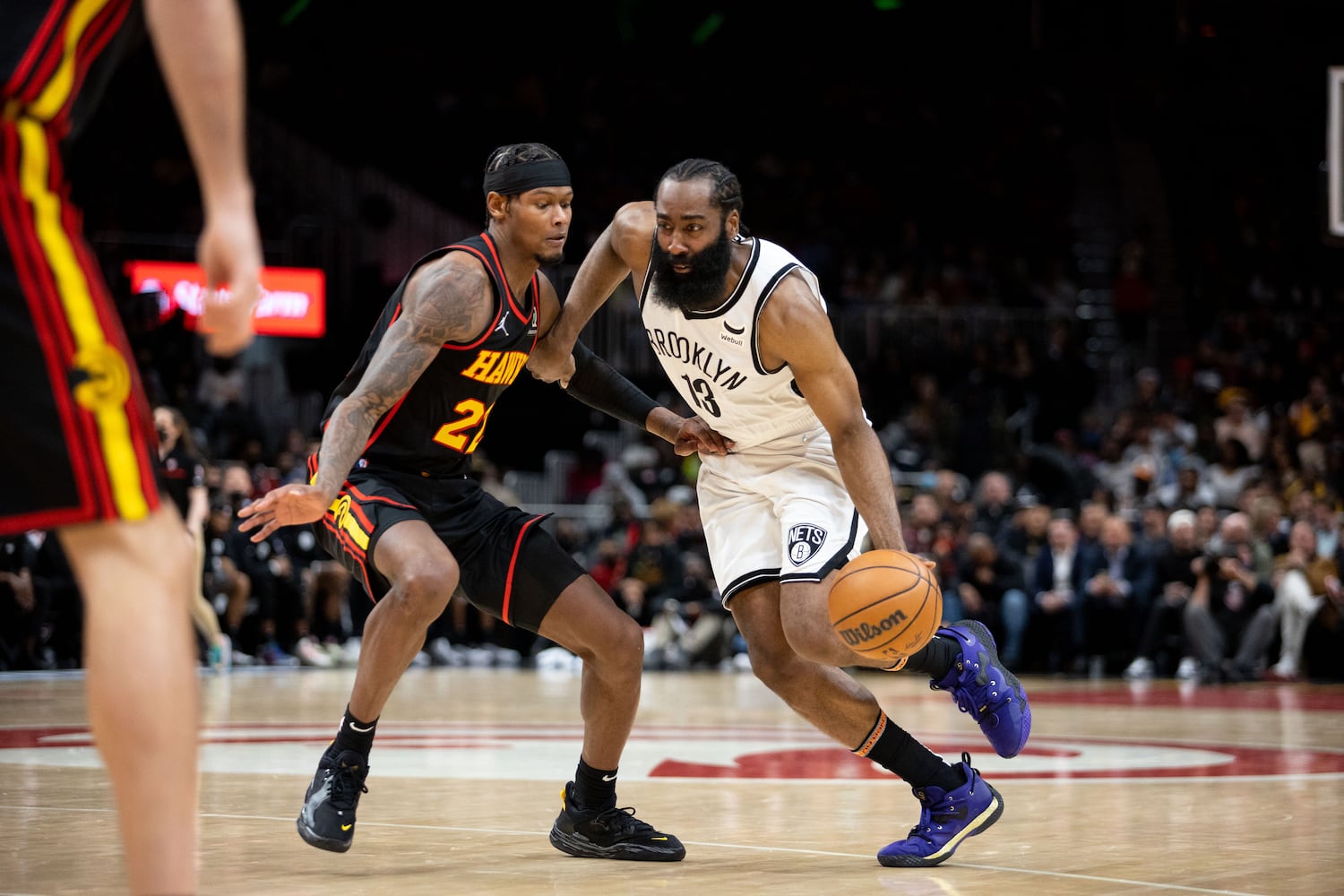 The Nets' James Harden (7) dribbles the ball during a game between the Atlanta Hawks and the Brooklyn Nets at State Farm Arena in Atlanta, GA., on Friday, December 10, 2021. (Photo/ Jenn Finch)