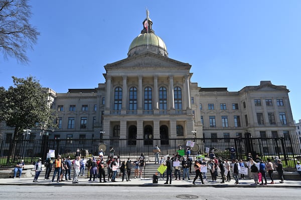 Educators, parents and activities rallied outside the Georgia State Capitol on Feb. 12, 2022 to protest legislation proposed by state GOP lawmakers that would limit what teachers may teach on race. (Hyosub Shin / Hyosub.Shin@ajc.com)