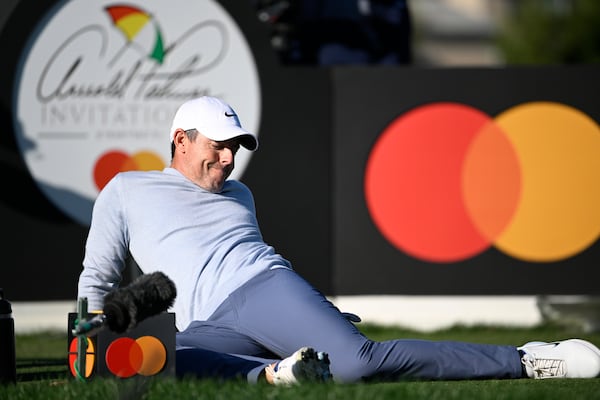 Rory McIlroy, of Northern Ireland, stretches while waiting to hit his tee shot on the 16th hole during the first round of the Arnold Palmer Invitational at Bay Hill golf tournament, Thursday, March 6, 2025, in Orlando, Fla. (AP Photo/Phelan M. Ebenhack)