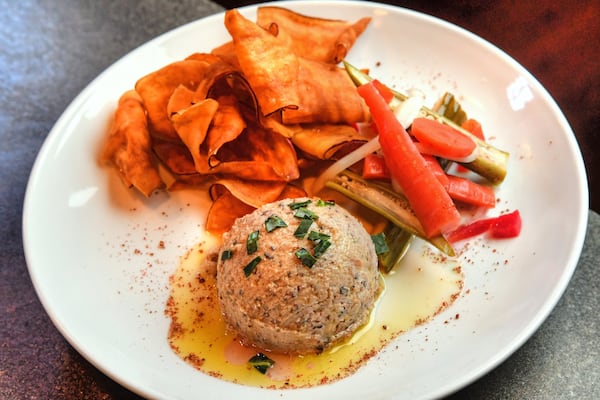 Black-Eyed Pea Hummus with house-fried sweet potato chips and pickles has been a menu favorite at Wisteria for nearly 20 years. STYLING BY JASON HILL / CONTRIBUTED BY CHRIS HUNT PHOTOGRAPHY