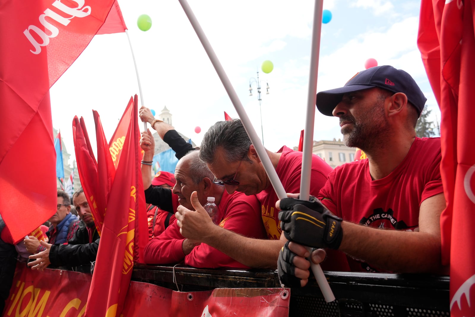 Workers of automotive sector gather in Rome's Piazza del Popolo Square during a demonstration on the occasion of their national strike, Friday, Oct. 18, 2024. (AP Photo/Gregorio Borgia)